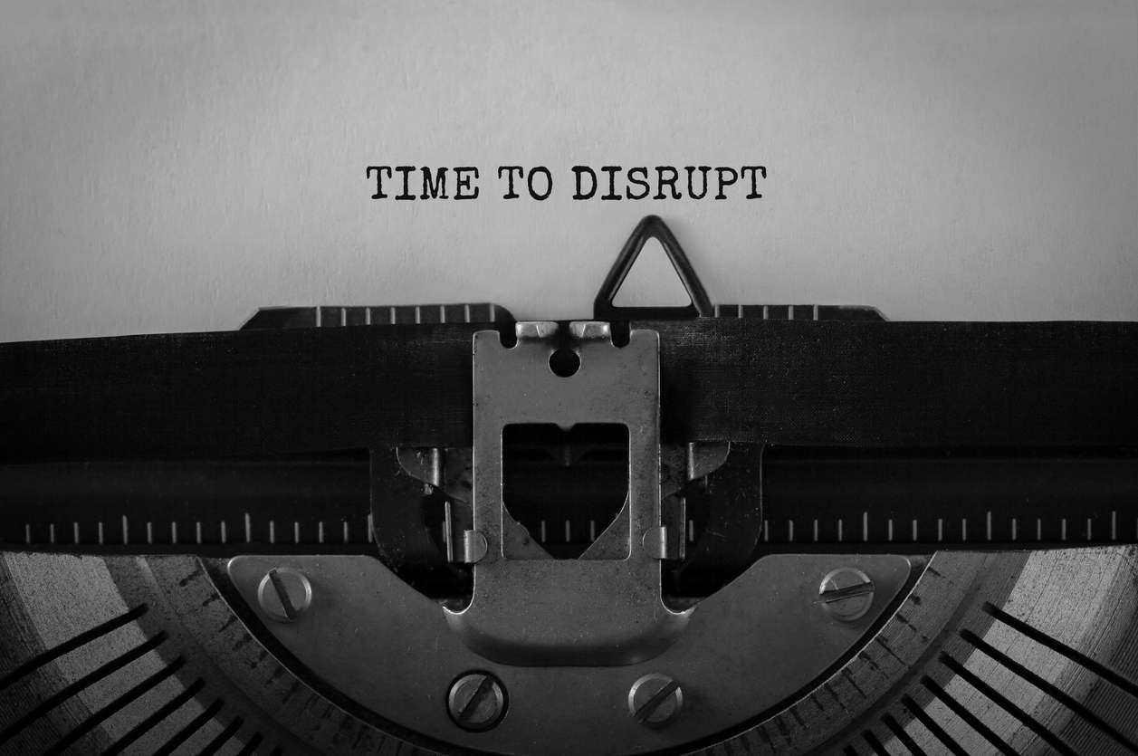 Black and white image that show text "TIME TO DISRUPT" typed on retro typewriter